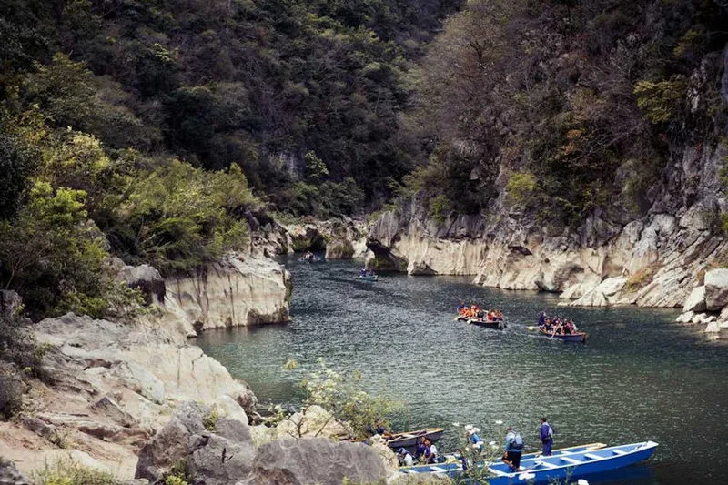Turquoise river pools and green limestone cliffs during Mexico's rainy season