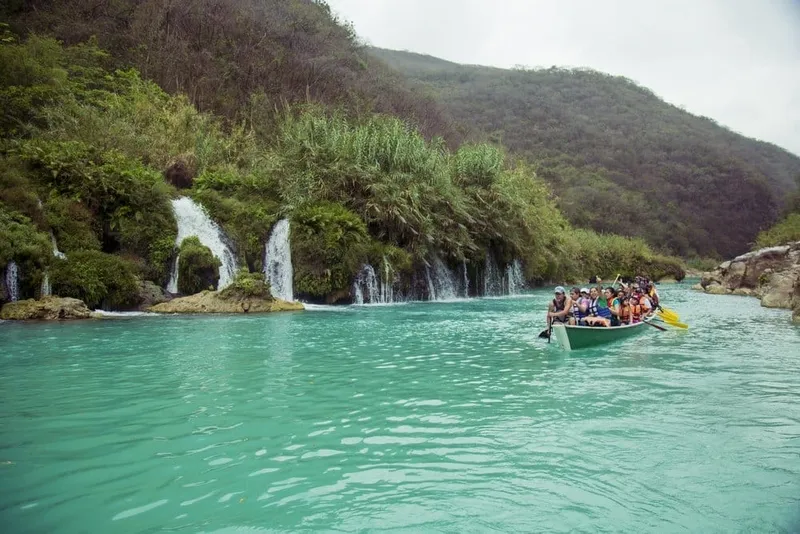 Turquoise Huasteca Potosina waterfall pools surrounded by limestone cliffs and dense green jungle