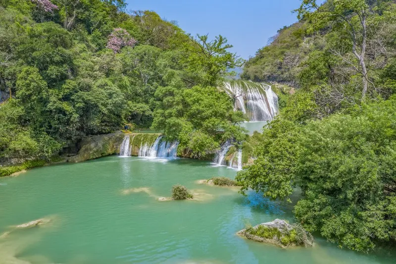 Micos waterfalls terraces with blue-green pools and rocky ledges