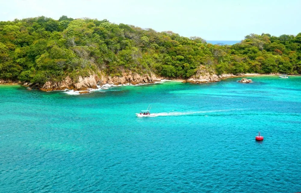 Santa Cruz Bay in Huatulco with the marina, tour boats, and calm protected waters