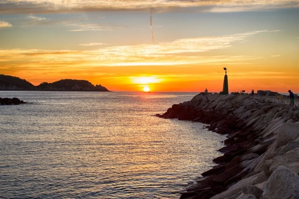 Chahué Bay marina in Huatulco at sunset with sailboats and beach clubs