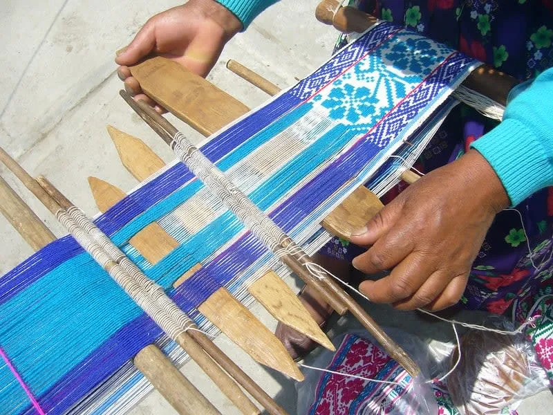 Mazahua woman weaving textiles in Mexico State