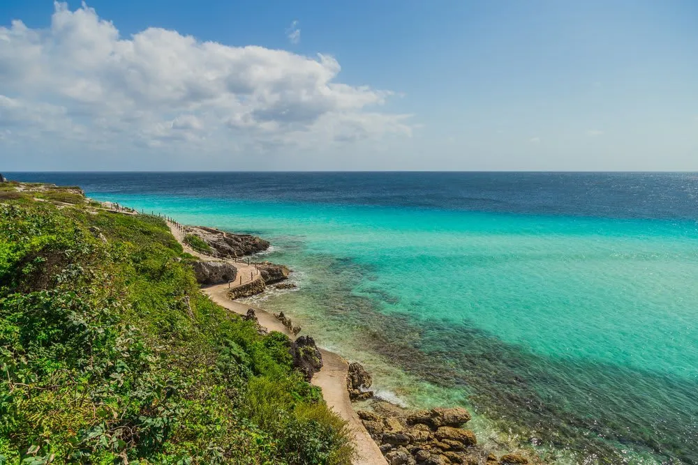 Rocky Caribbean shoreline and turquoise water near Garrafon Natural Reef Park