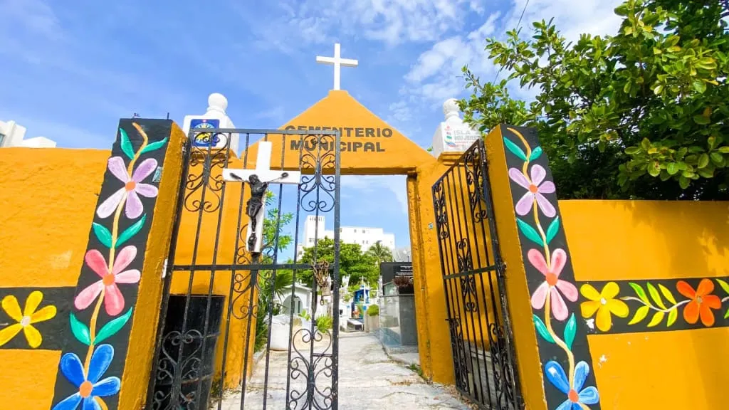 Colorful graves and blue-painted tombs in the Isla Mujeres cemetery