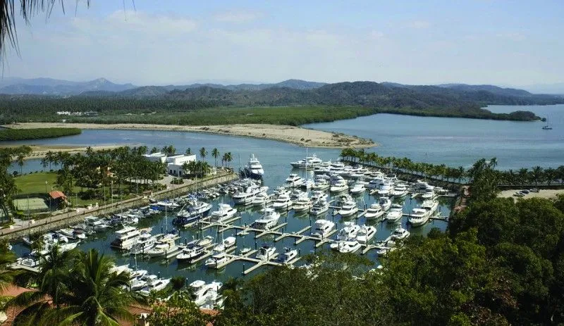 Isla Navidad Colima Mexico coastal lagoon and marina resort with tropical vegetation and Pacific Ocean