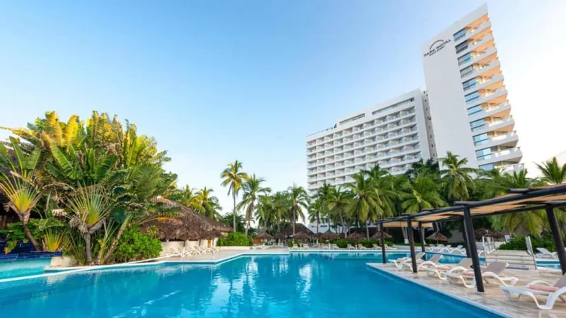 Ixtapa hotel-zone beach area in March with resort bases, pools, and Pacific Coast trip planning