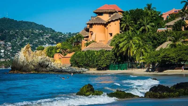 Hillside hotel view over Zihuatanejo Bay for a December beach stay near La Ropa
