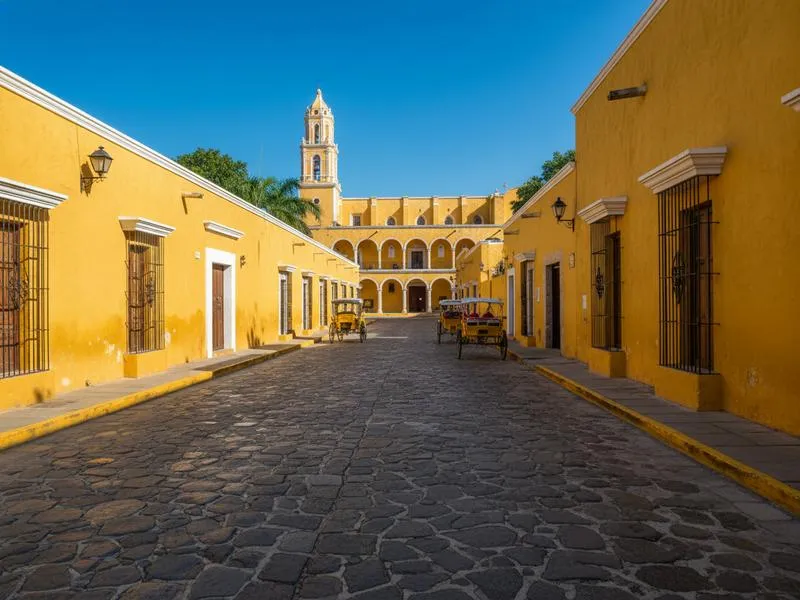 Golden yellow colonial buildings and the Convento de San Antonio de Padua in Izamal, the Yellow City of Yucatan Mexico