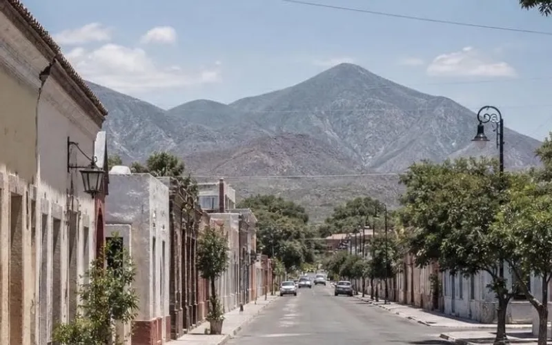 Clear February afternoon near Linares historic center with Nuevo Leon foothills beyond the streets