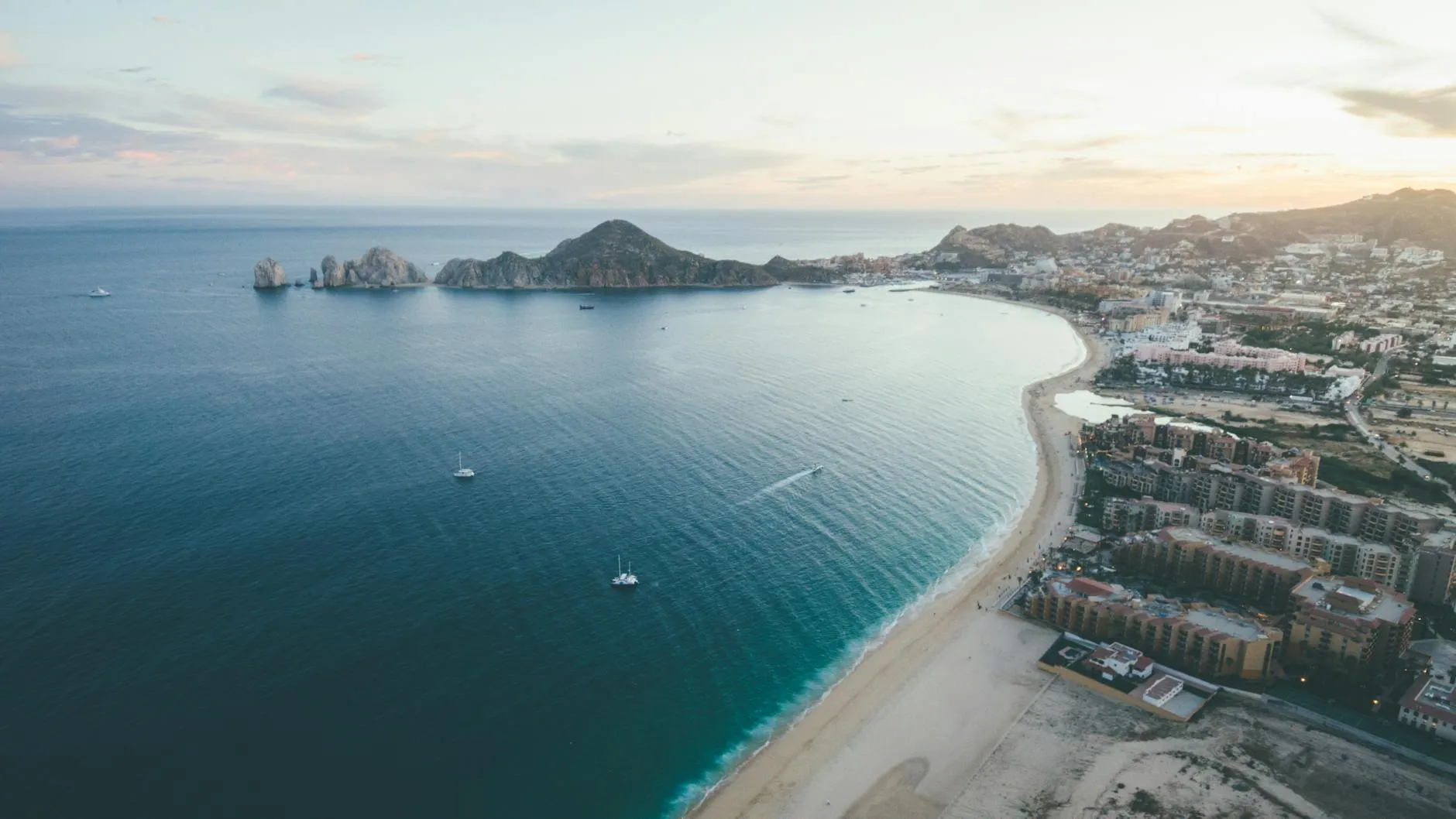 All-inclusive resort in Los Cabos with Pacific Ocean view and dramatic rock formations in background