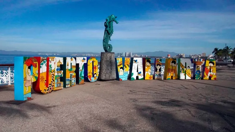 Puerto Vallarta Malecón boardwalk seafront with restaurants and views of Banderas Bay — the waterfront has tourist-priced restaurants but excellent views