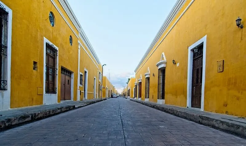 Yellow colonial buildings and arches in Izamal Yucatan