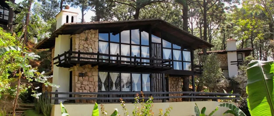 Cabins surrounded by pine trees in the mountains of Mazamitla