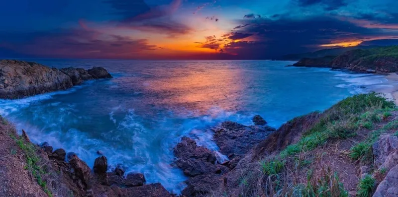 Mazunte beach and Pacific Coast hills during hot June rainy-season weather