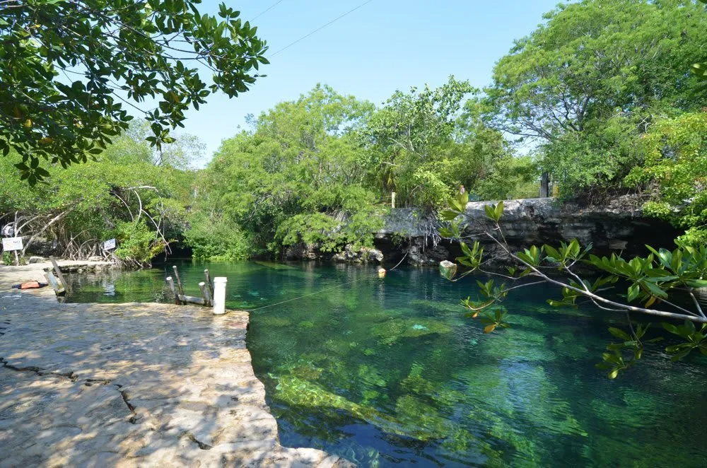 Open-air Cenote 360 near Mérida Yucatán with circular rim and turquoise water below