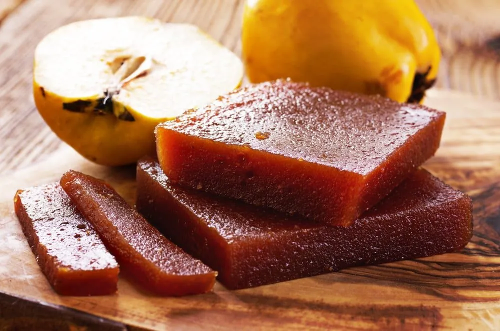Blocks of ate fruit paste cut into colorful quince-style slices