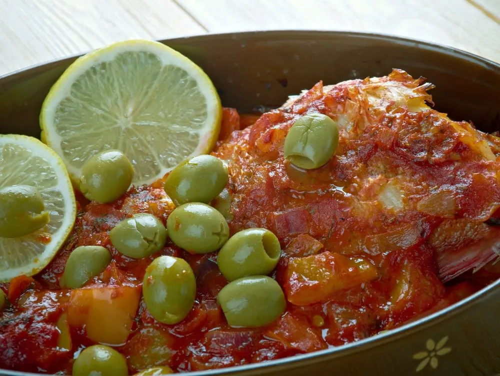 Veracruz-style fish with tomato, olives, peppers, and herbs
