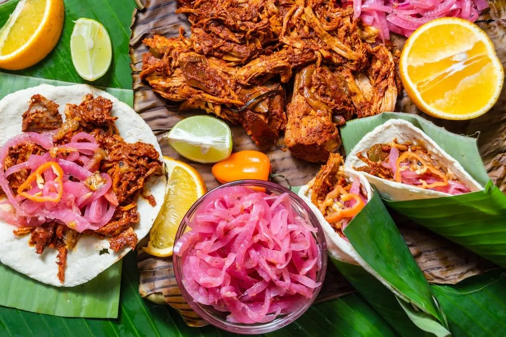Cochinita pibil pork cooked with achiote and banana leaves