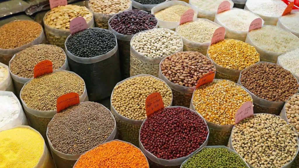 Bowls of dried Mexican beans in different colors and sizes