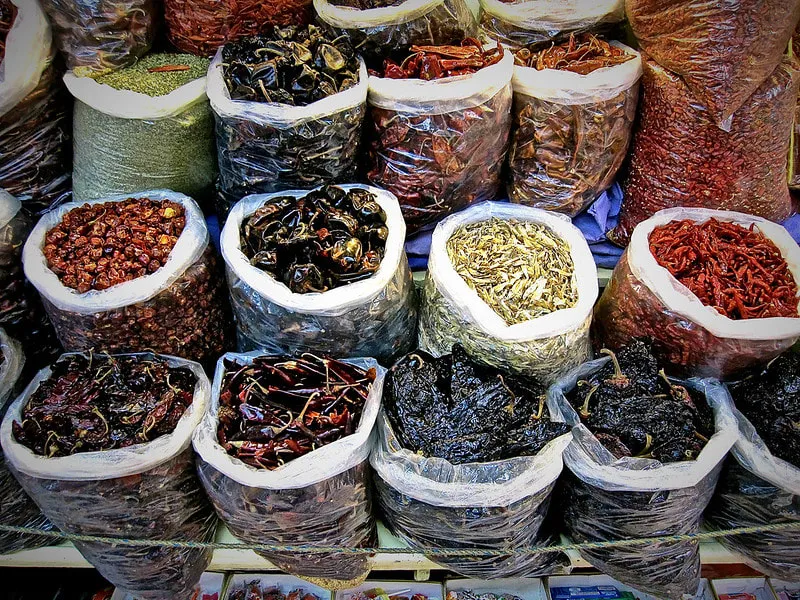 Assorted dried and fresh Mexican chiles in red and green colors
