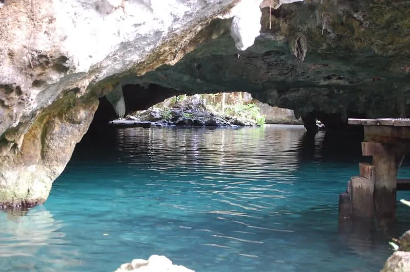 Gran Cenote near Tulum — turquoise water inside a limestone cave with stalactites