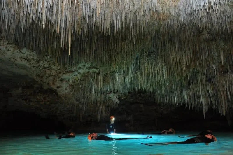 Rio Secreto underground river near Playa del Carmen — cave system with stalactites and shallow underground stream