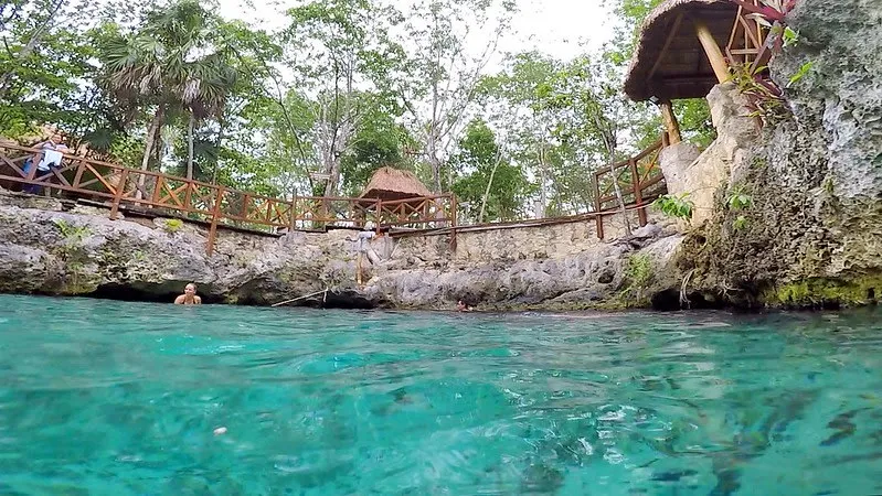 Cenote Zacil-Ha near Tulum — small lagoon with zip line and palapa infrastructure