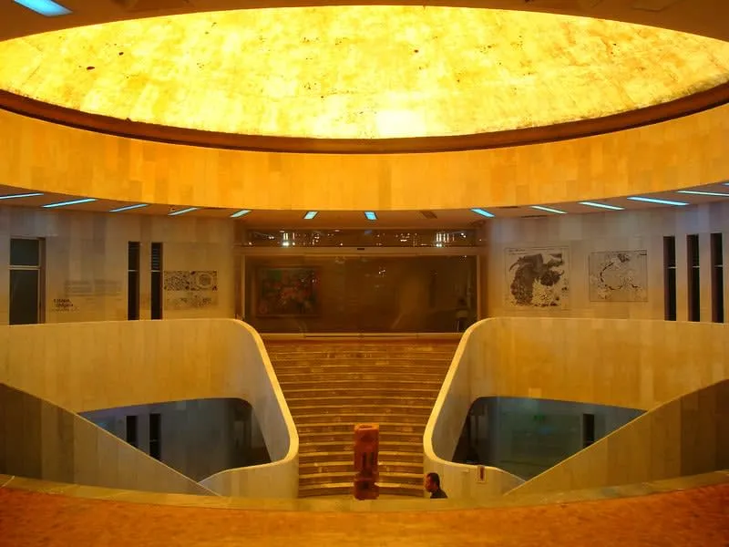 Modern art museum gallery with paintings and sculpture displays
