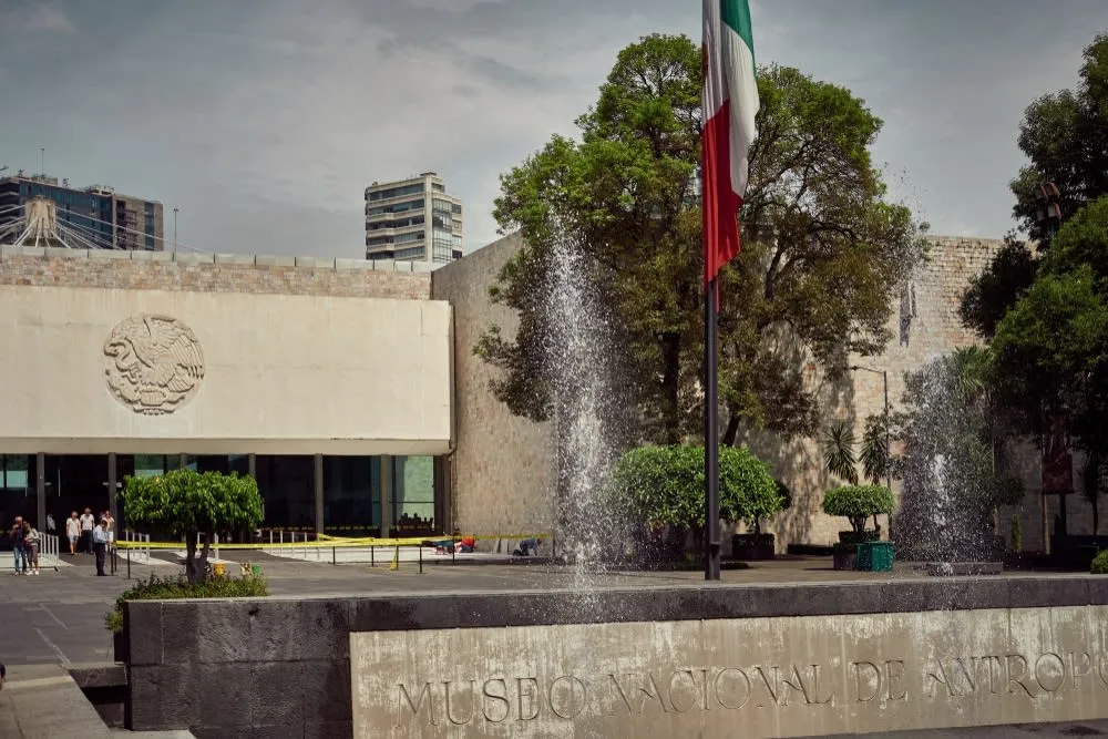 National Museum of Anthropology courtyard with umbrella fountain and exhibit halls