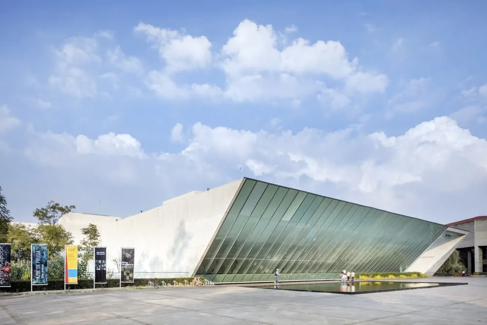MUAC contemporary art museum gallery with white walls and large installations