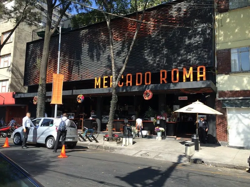 Food stalls and seating inside Mercado Roma in Mexico City