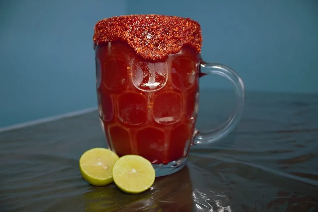 Chamoy-coated chamochela with chili powder on the rim