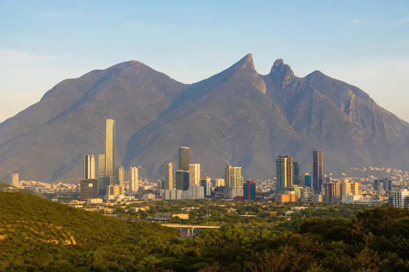 Cerro de la Silla behind Monterrey buildings on a dry spring day