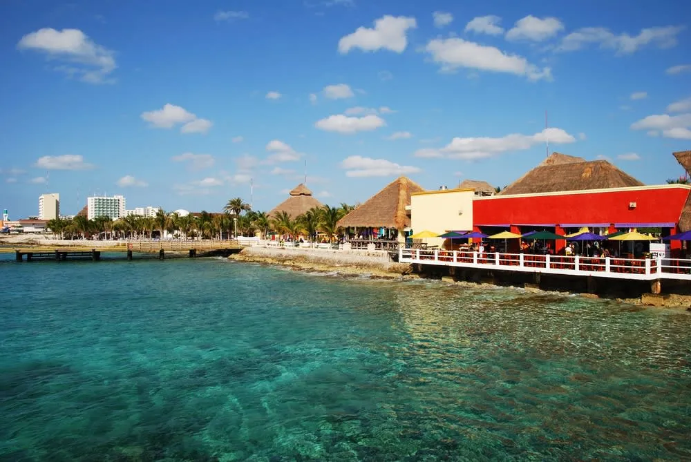 Cozumel waterfront with turquoise Caribbean water and palm trees