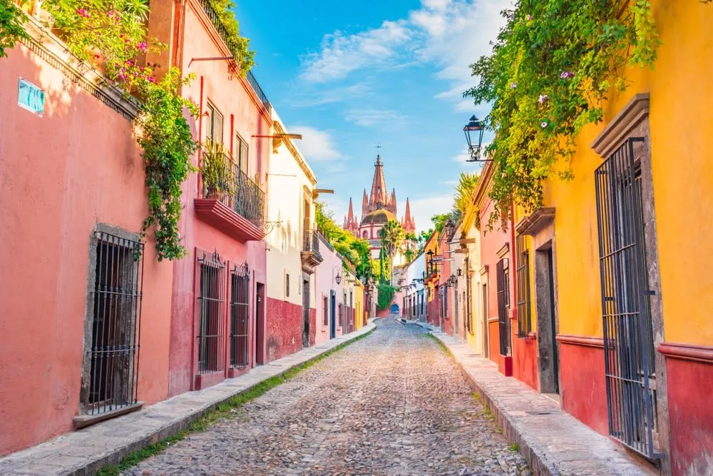 Parroquia de San Miguel Arcangel rising above colonial rooftops in San Miguel de Allende