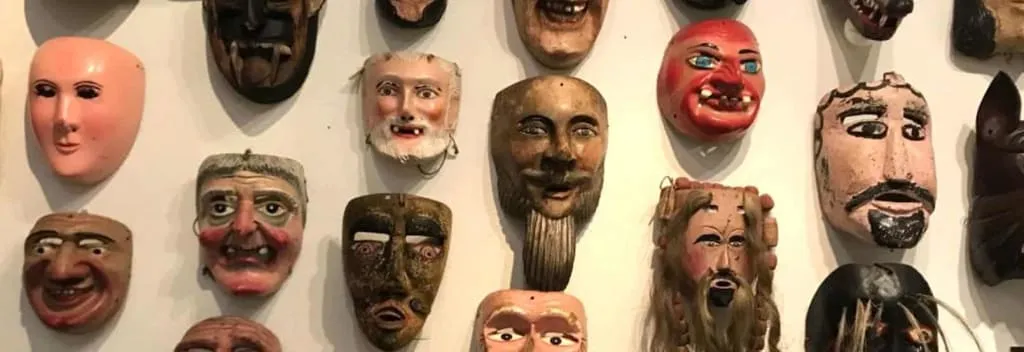 Museum gallery displaying Totonaca objects and traditional masks