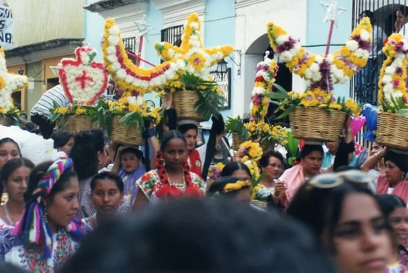 Dancers in traditional indigenous costumes performing at the Guelaguetza festival in Oaxaca, July celebration