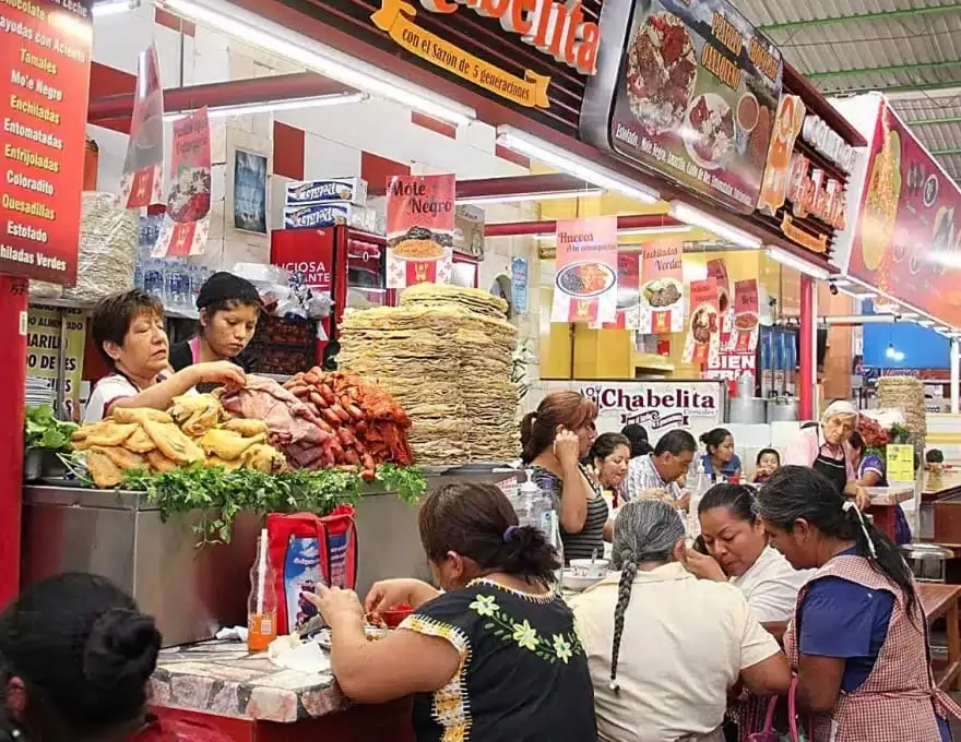 Yecapixtla Mercado Municipal market stalls with cecina de res and cecina enchilada displayed — family-run stalls operating for generations