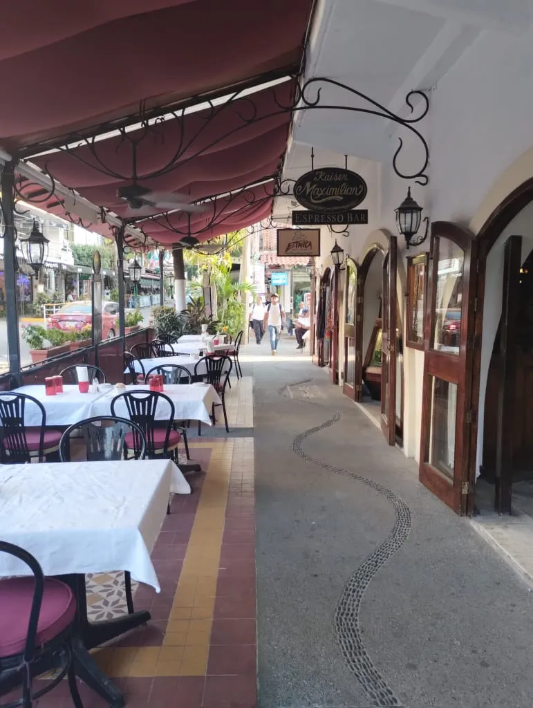 Puerto Vallarta old town neighborhood with local cafe and cobblestone street at dusk