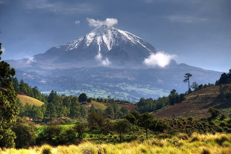 Pico de Orizaba volcano — Mexico's highest peak at 5,636 meters with snow-capped summit visible from Orizaba city