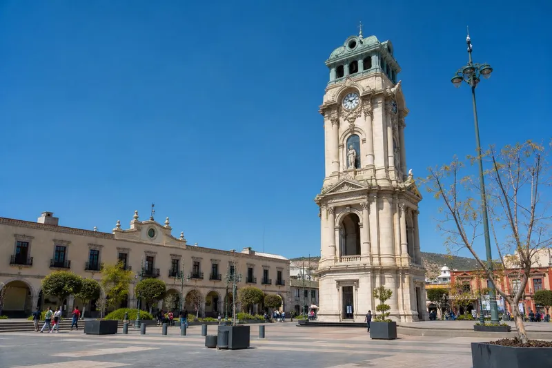 Pachuca clock tower and central plaza during clear February weather in Hidalgo