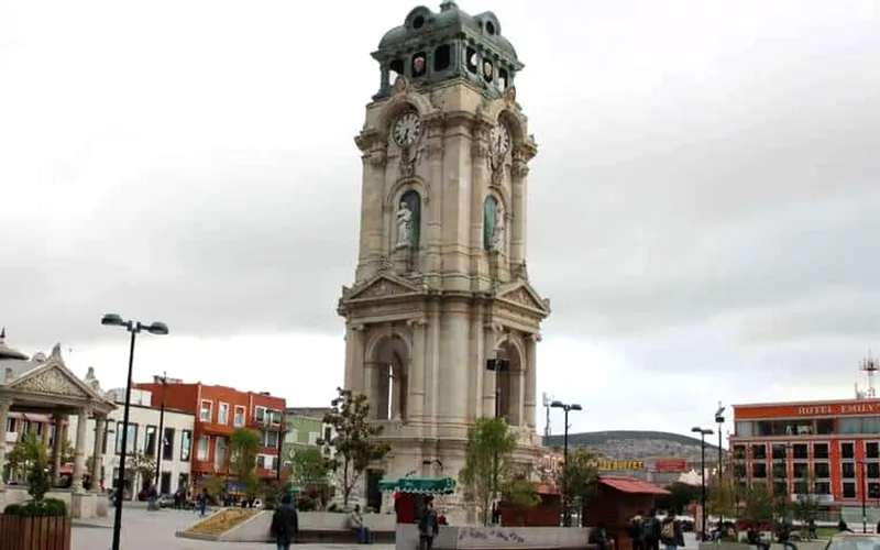 Pachuca clock tower and central plaza during June rainy-season weather in Hidalgo