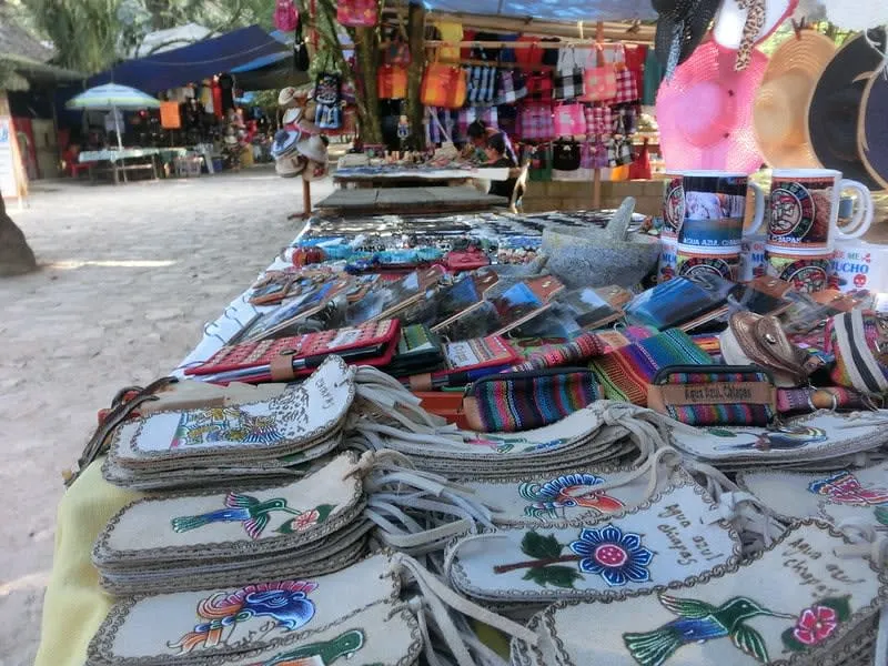 Traditional crafts for sale near Palenque Chiapas ruins — amber jewelry, embroidered textiles, and ceramics by Chol artisans