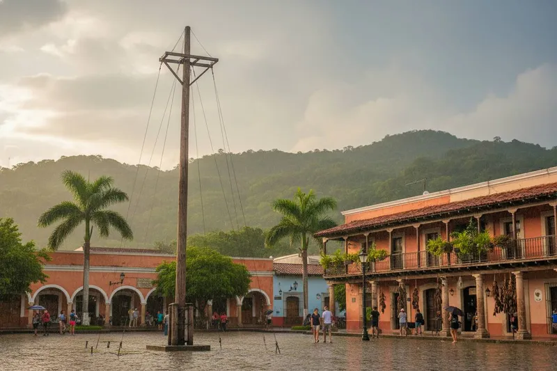 Colorful Papantla hillside buildings and church towers surrounded by green Veracruz slopes