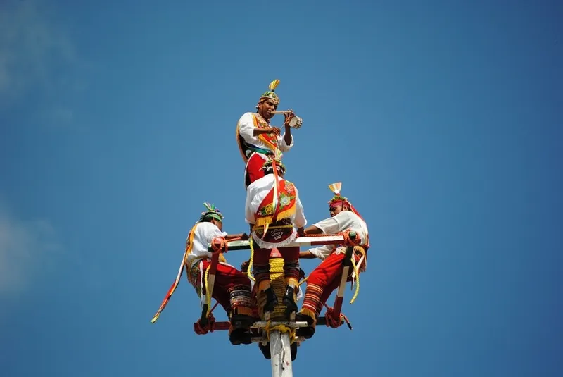 Papantla plaza with Voladores pole and vanilla shops under bright Veracruz sun