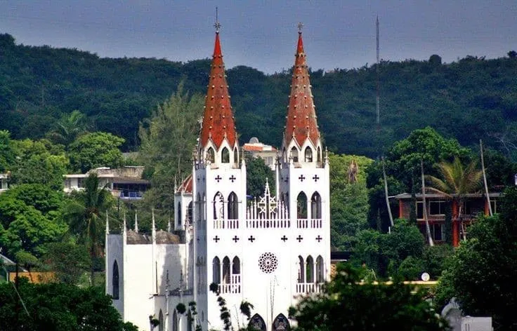 Neo-Gothic Christ the King chapel with pointed arches and twin towers