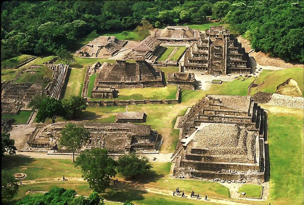 Pyramid of the Niches rising above the grass at El Tajín