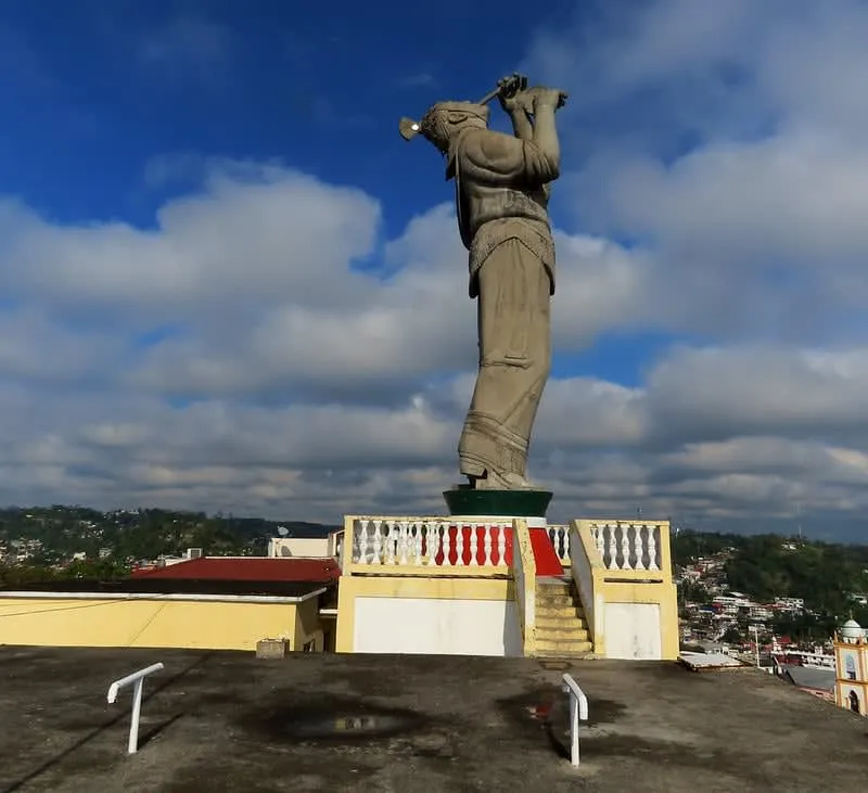 Monumento al Volador sculpture overlooking the green hills of northern Veracruz