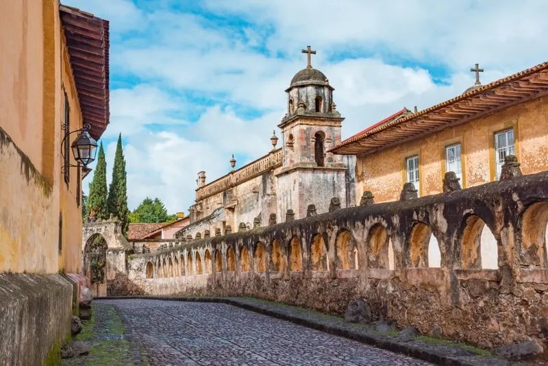 Colonial rooftops in Pátzcuaro beneath early rainy-season clouds