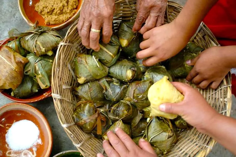 Traditional Michoacán food market in Pátzcuaro with fresh fish, corundas, and regional specialties